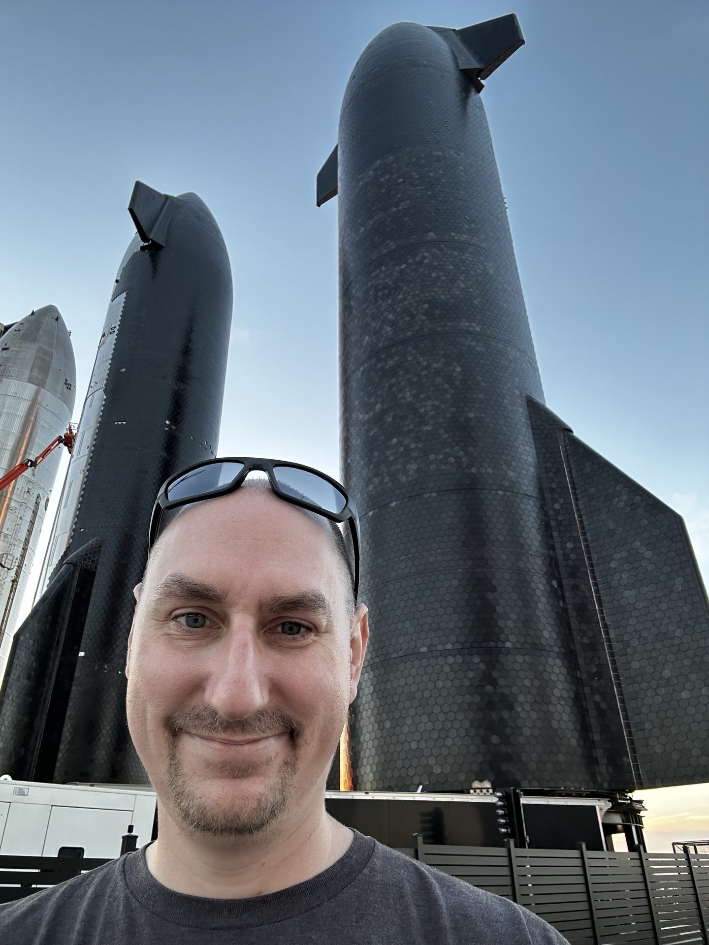 Chris Strandt with SpaceX rocket in background